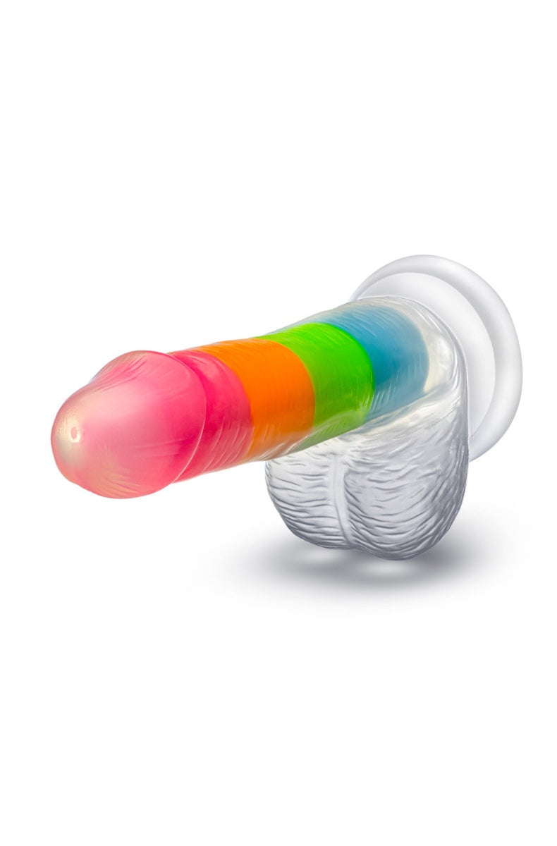 Angled view of rainbow dildo showing textured balls and suction cup base on white background