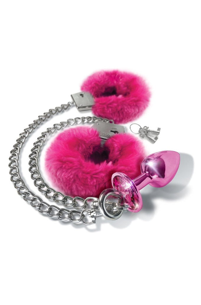 Complete restraint set with pink fur cuffs, silver chain, and pink metallic butt plug with keys