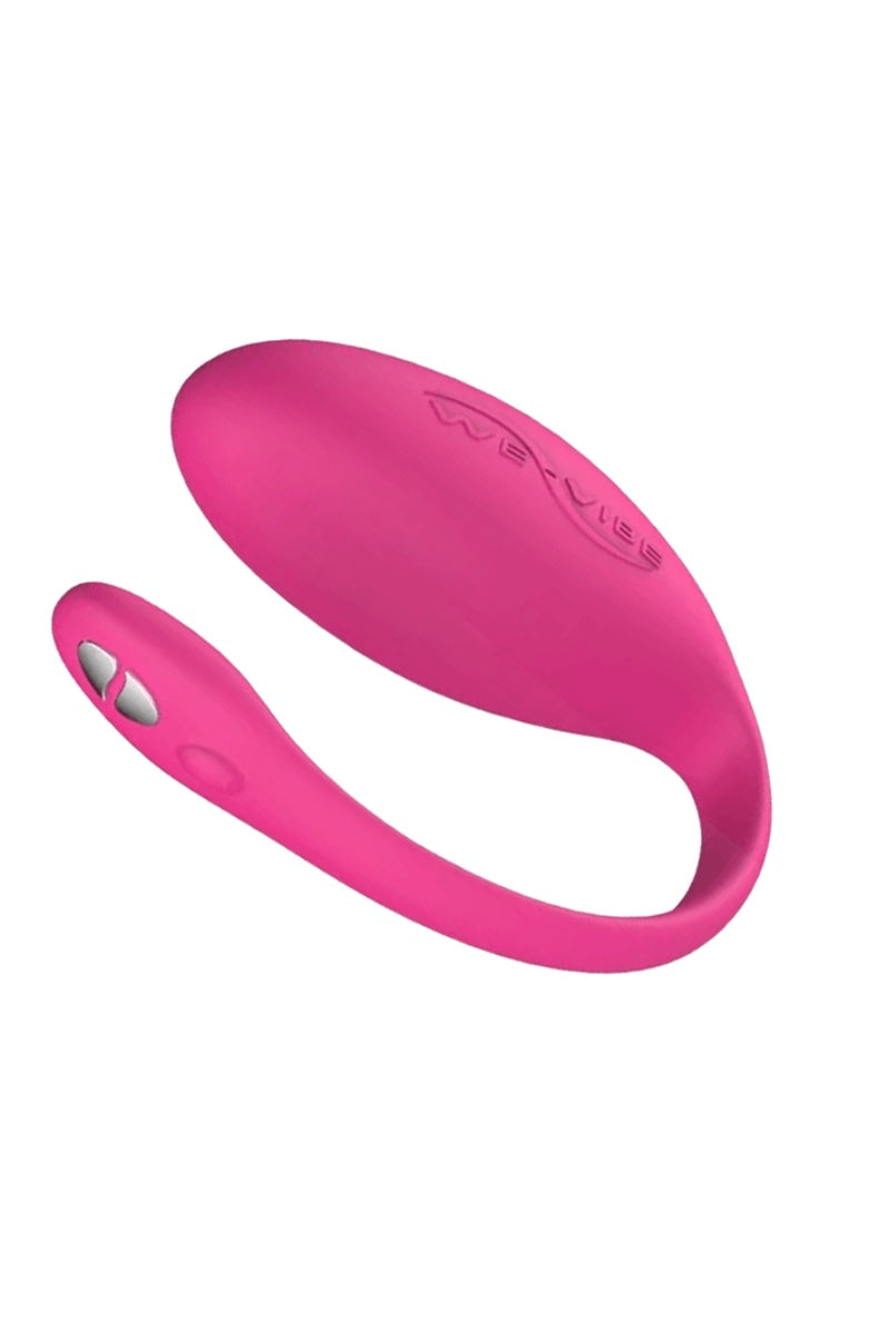 Pink C-shaped wearable vibrator showing We-Vibe logo embossed on surface