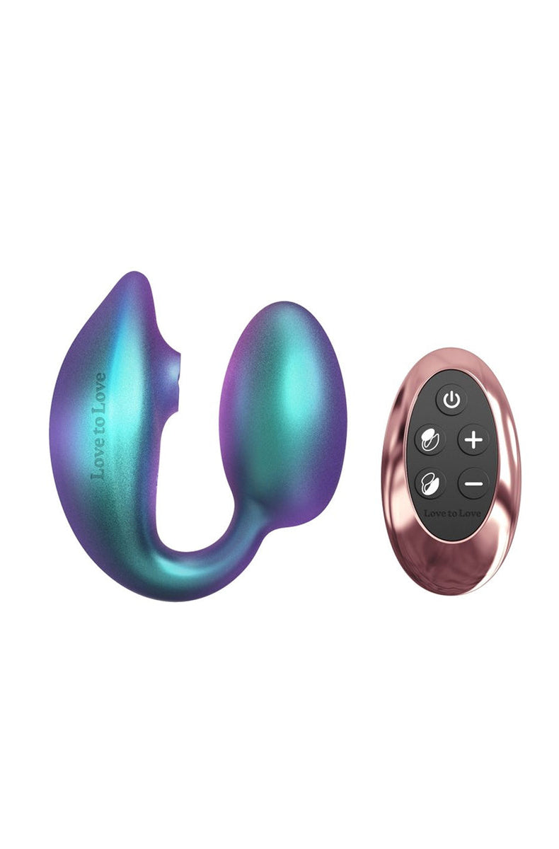 Love to Love Wonderlover couples vibrator in iridescent purple and teal silicone next to its rose-gold remote control.