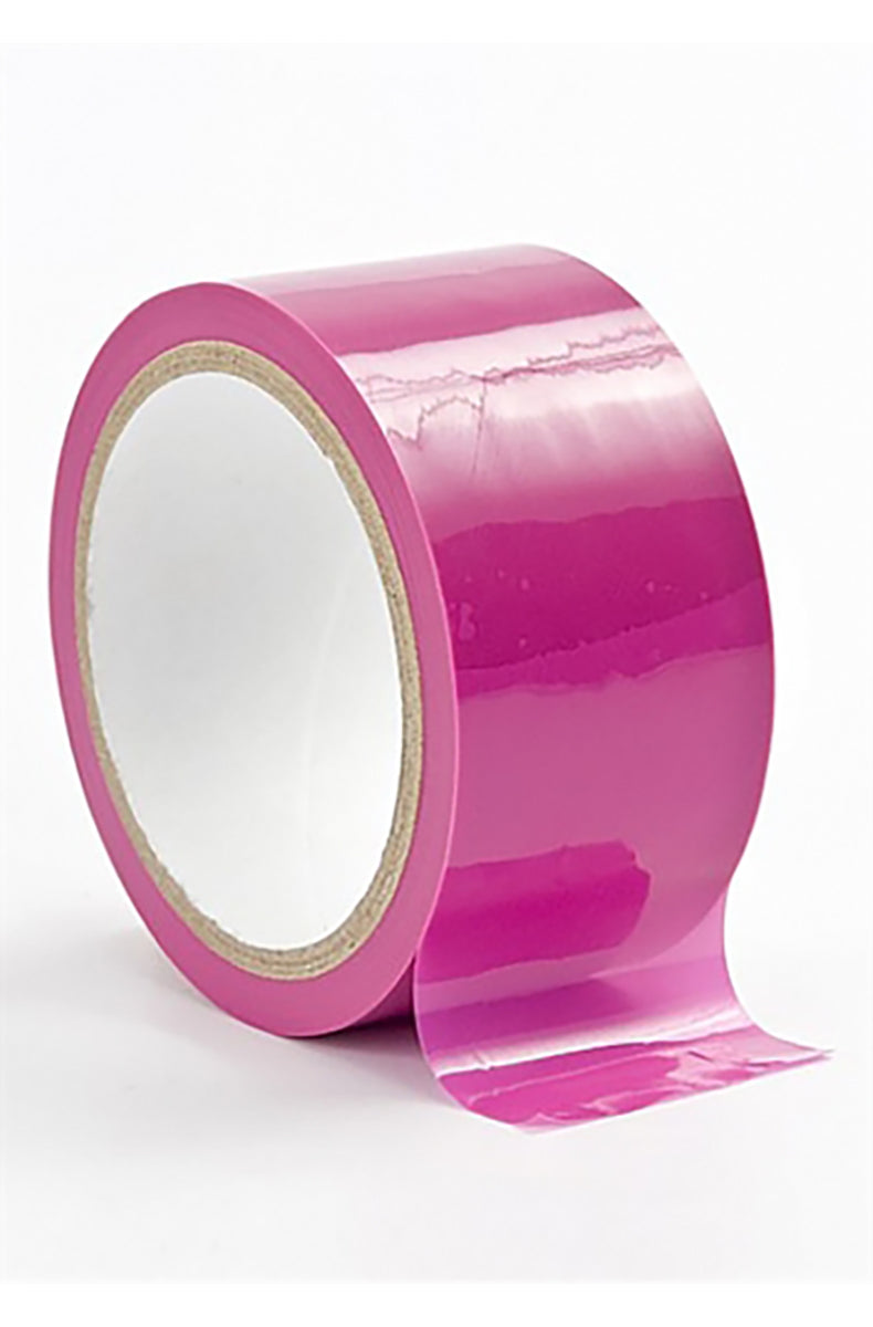 Roll of shiny pink PVC bondage tape with a loose tail unrolling from the spool on a white background.