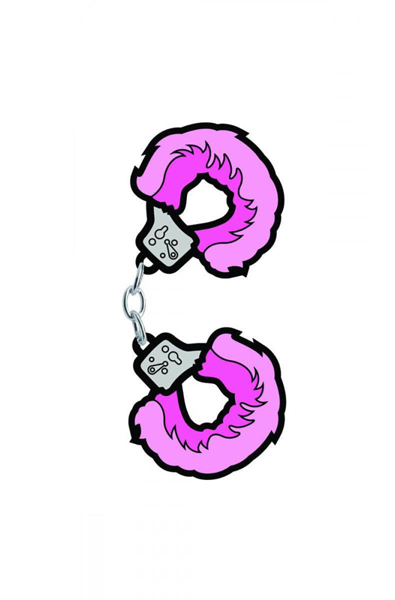 Hot-pink fuzzy handcuffs enamel pin with two cuffs joined by a tiny silver chain, attached to a denim jacket pocket.