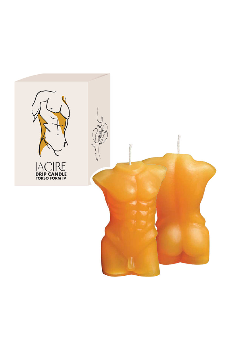 Two orange-yellow LaCire male torso drip candles beside a cream box labeled LaCire Drip Candle Torso Form IV.