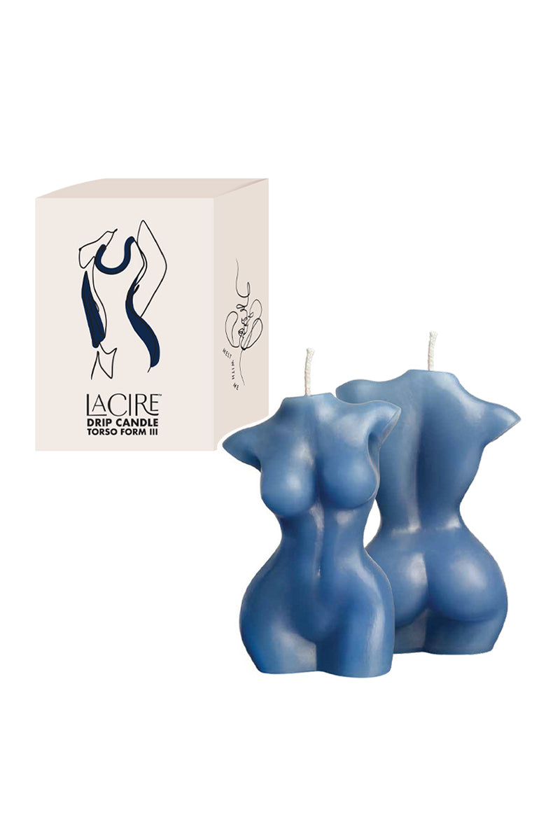 Two blue LaCire female torso drip candles beside a cream box labeled LaCire Drip Candle Torso Form III.
