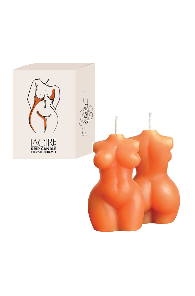 Two orange LaCire curvy female torso drip candles beside a cream box labeled LaCire Drip Candle Torso Form I.