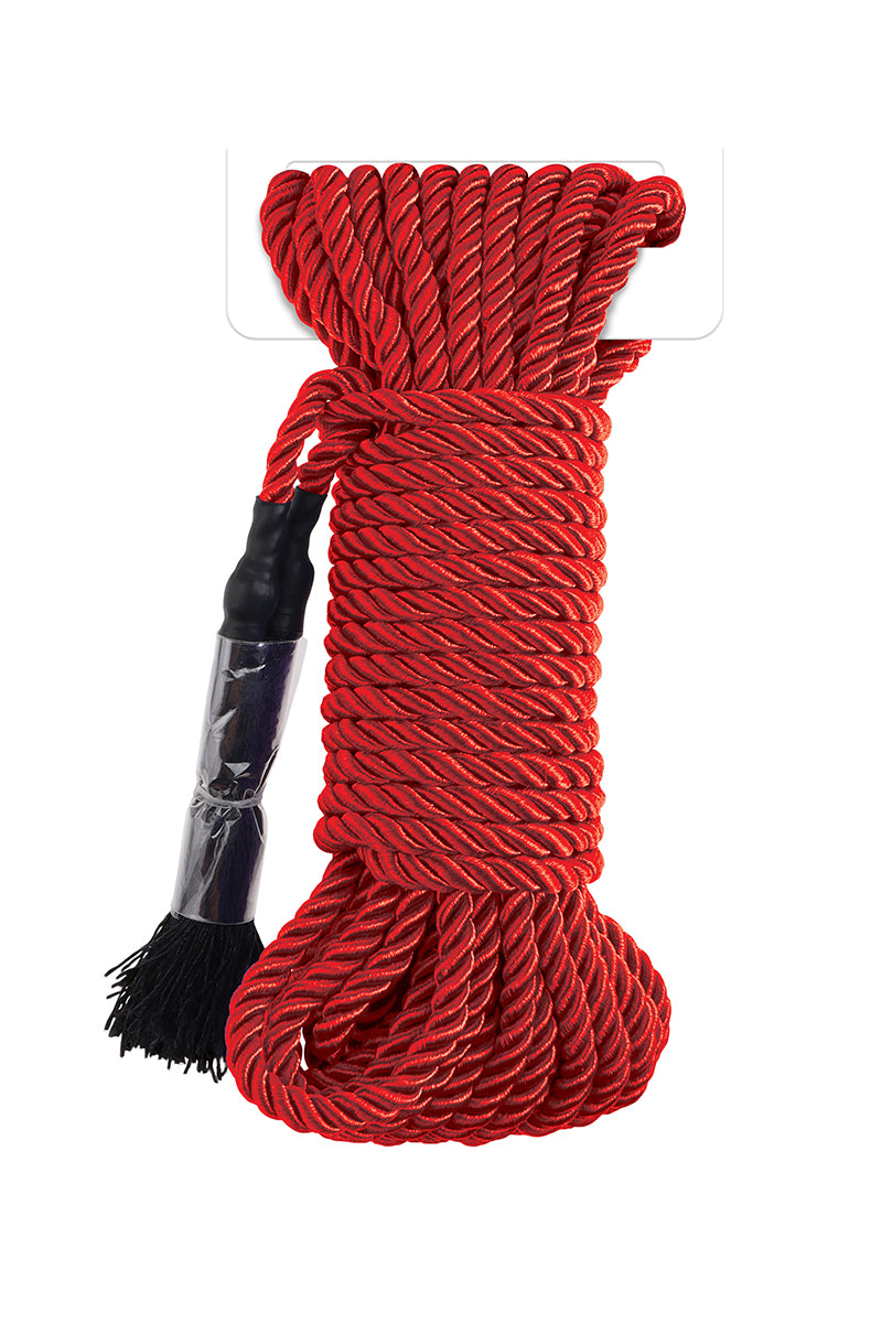 Coiled bundle of glossy red braided silky bondage rope with black sealed end caps and small fringe tassels.