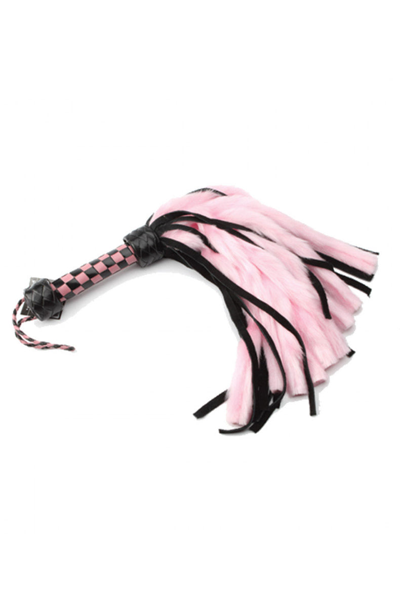 Pink and black flogger with soft pink faux-fur tails and black suede tails on a pink and black checkered handle.