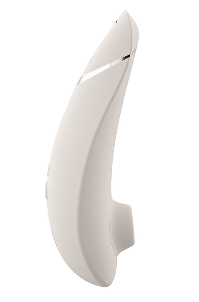 Side view of Womanizer Premium 2 in matte light-gray sand silicone with chrome accent stripe and single side control.