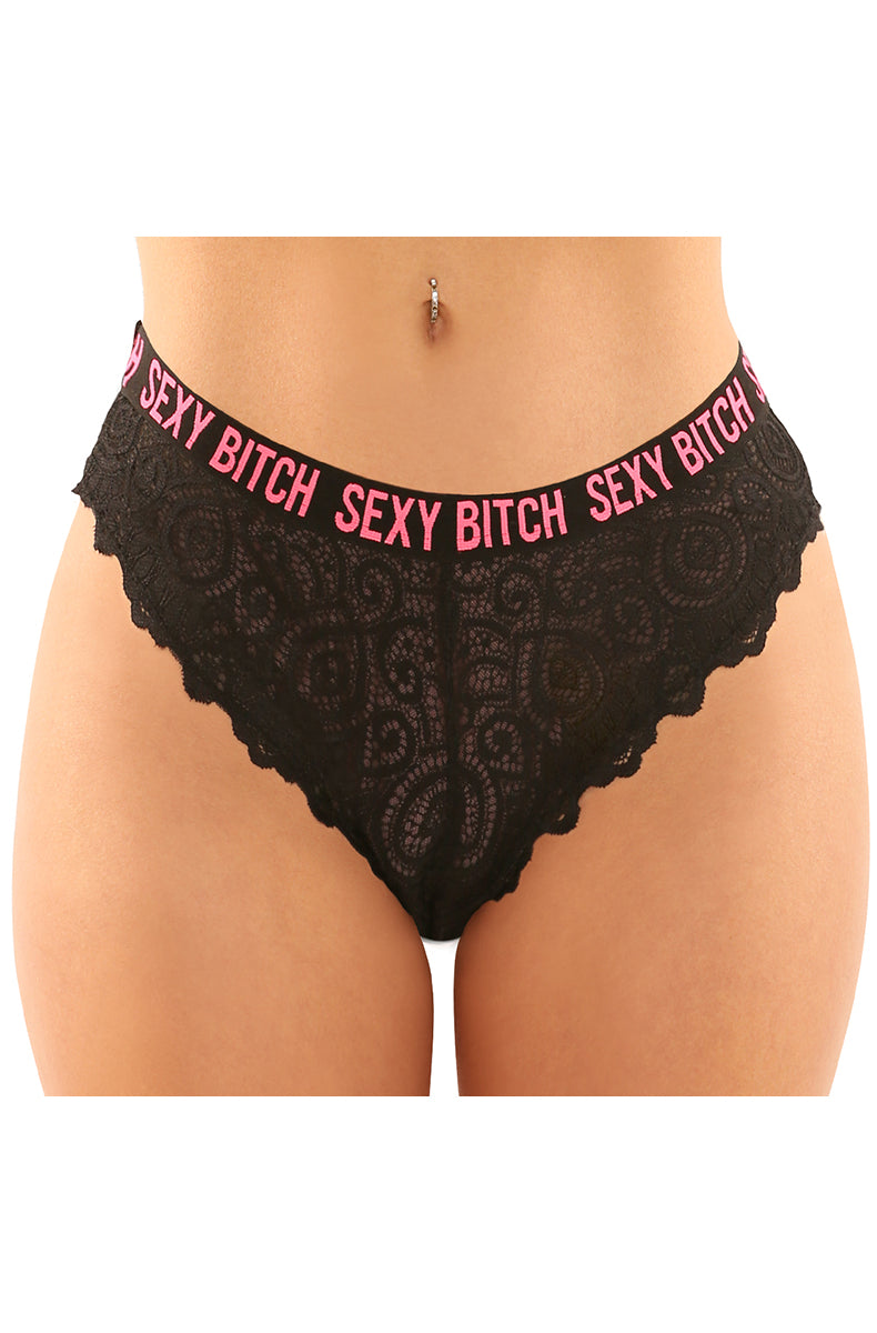 Black paisley lace cheeky-cut panty with a wide black elastic waistband repeating "SEXY BITCH" in pink lettering and scalloped lace trim along the leg openings.