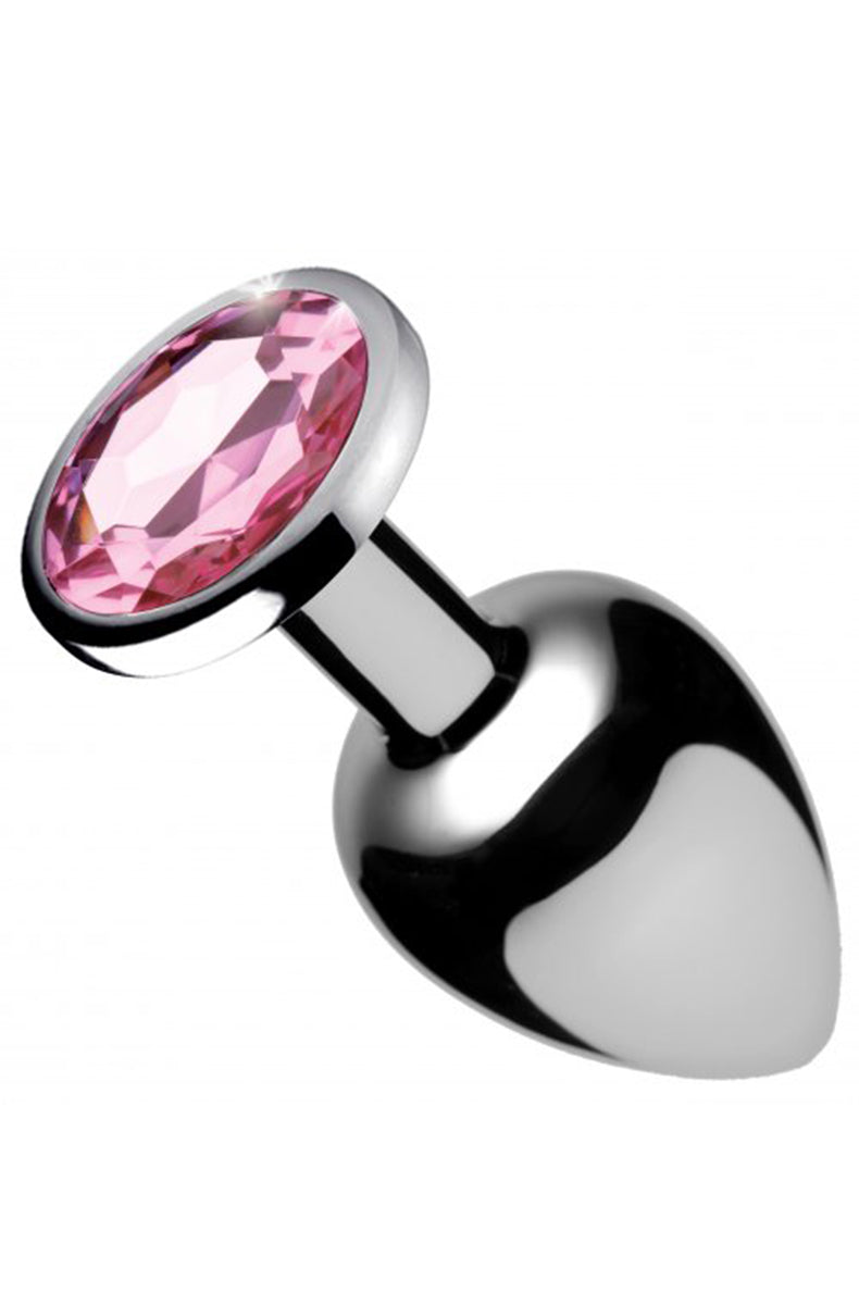 Polished aluminum anal plug with tapered tip, narrow neck, and round flared base set with a faceted pink gem.