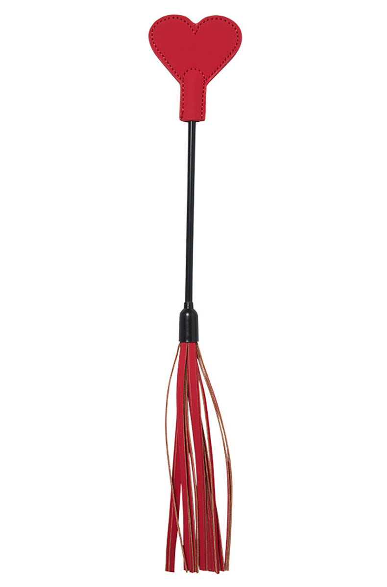 Red faux leather crop with a heart-shaped tip on a black handle, with a red mini-flogger of leather tassels at the base.