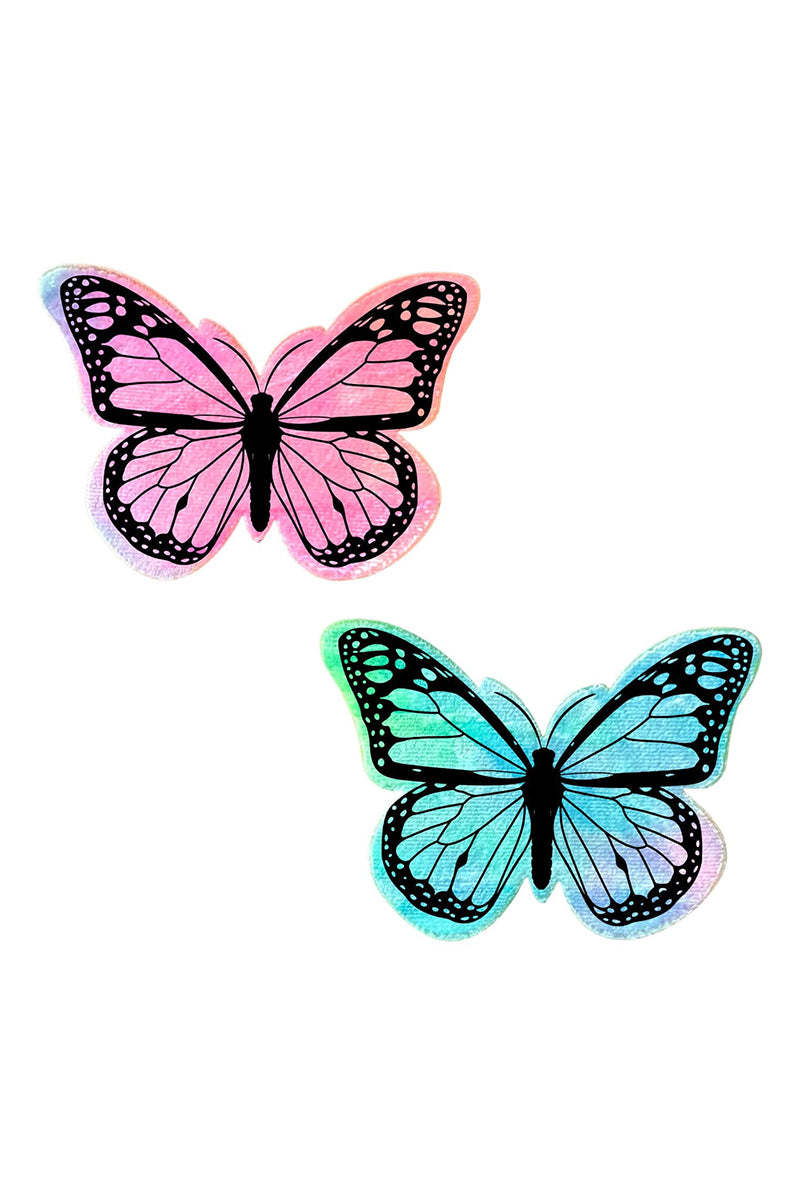 Two butterfly-shaped pasties in tie-dye finish: one coral pink, one teal mint, both with detailed black monarch-style wing-vein print.
