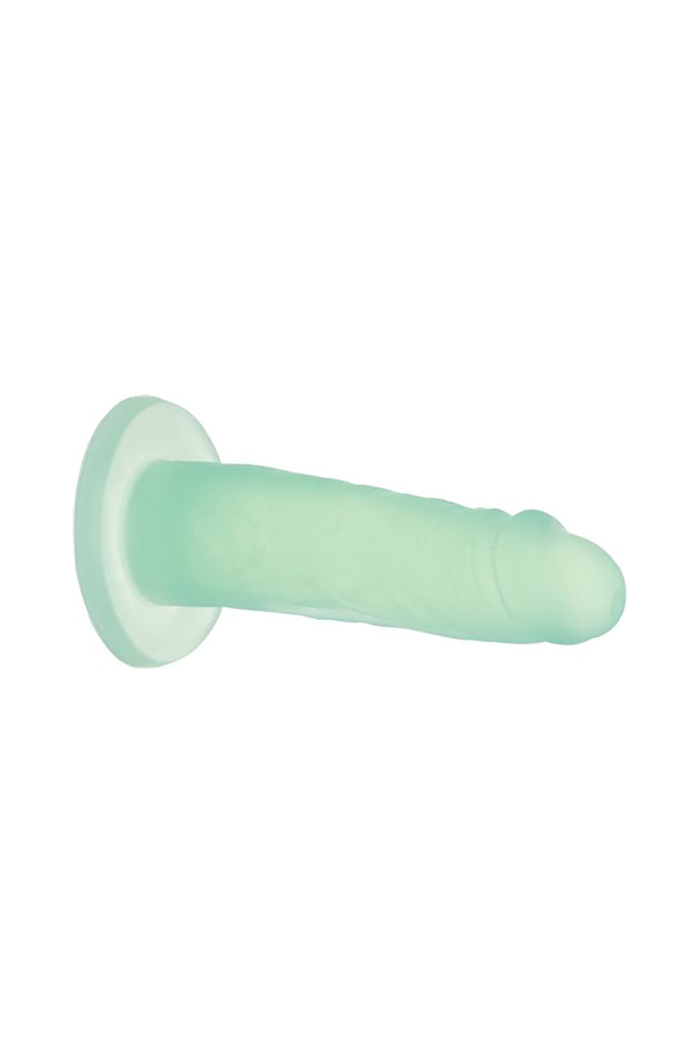 Mint green dildo laid flat horizontally on white showing profile and base
