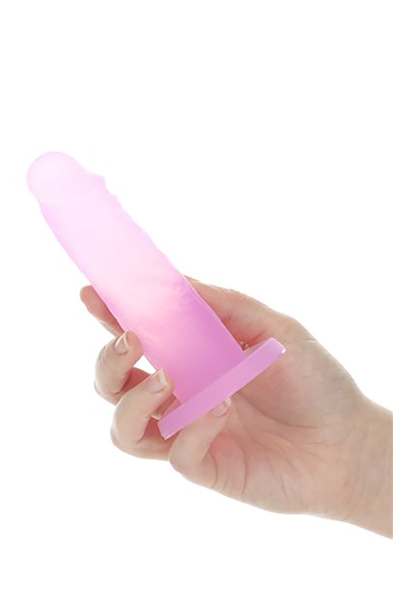 Side view of the Cosmo Cocktails translucent pink silicone dildo showing the suction base and shaft profile.