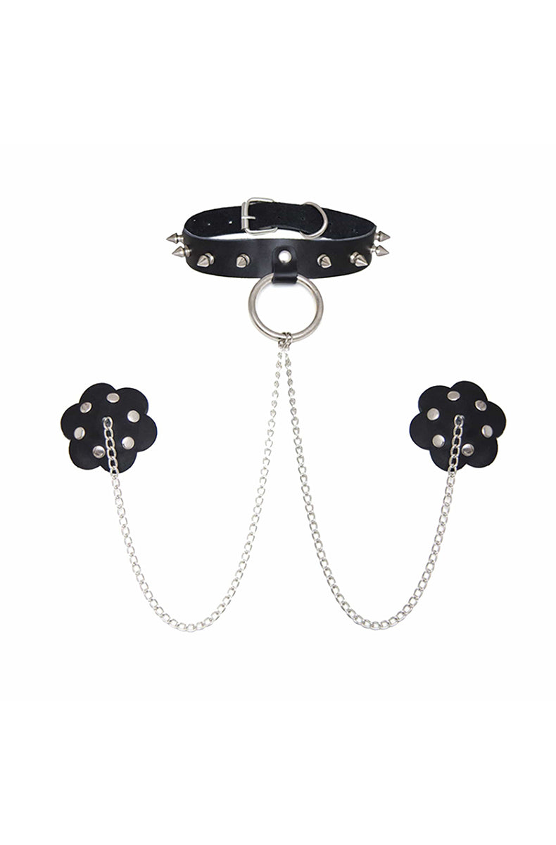 A three-piece set: a spiked black-leather choker with a silver D-ring connected by silver chains to two flower-petal black-leather pasties studded with silver rivets.