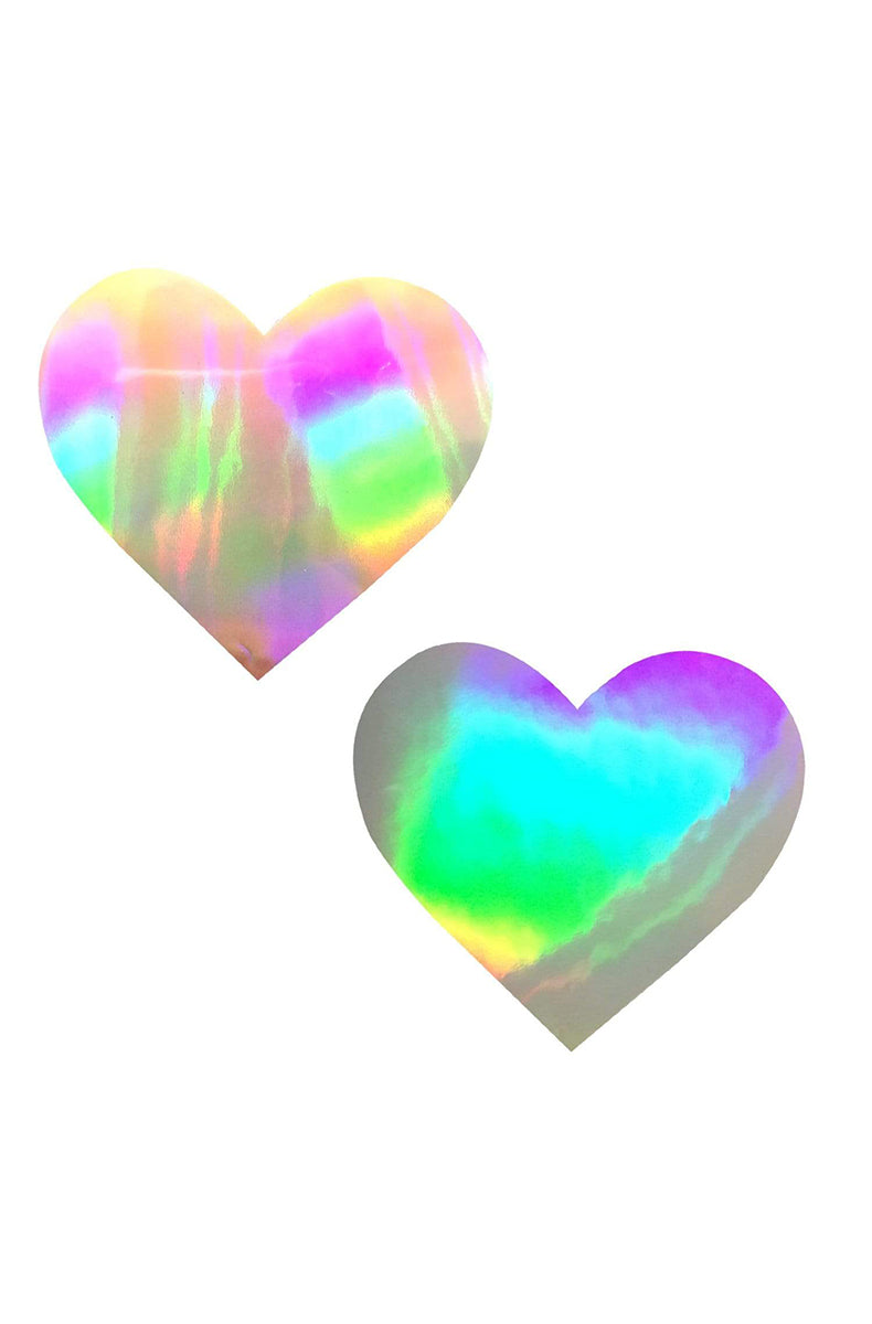 Two heart-shaped holographic pasties with an oil-slick rainbow finish that shifts pink, blue, green, and purple.