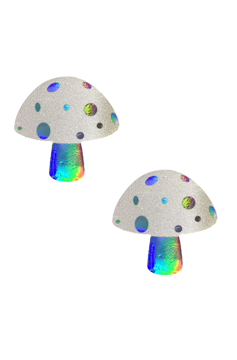 Two mushroom-shaped pasties with a white-glitter cap dotted with holographic spots in green, purple, and blue, and a holographic stem.