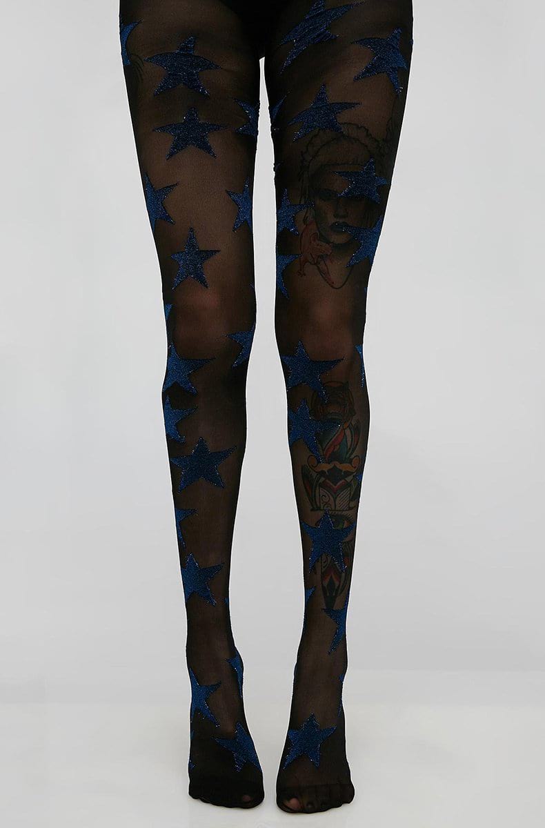 Black sheer tights printed with large blue-glitter stars scattered across both legs.