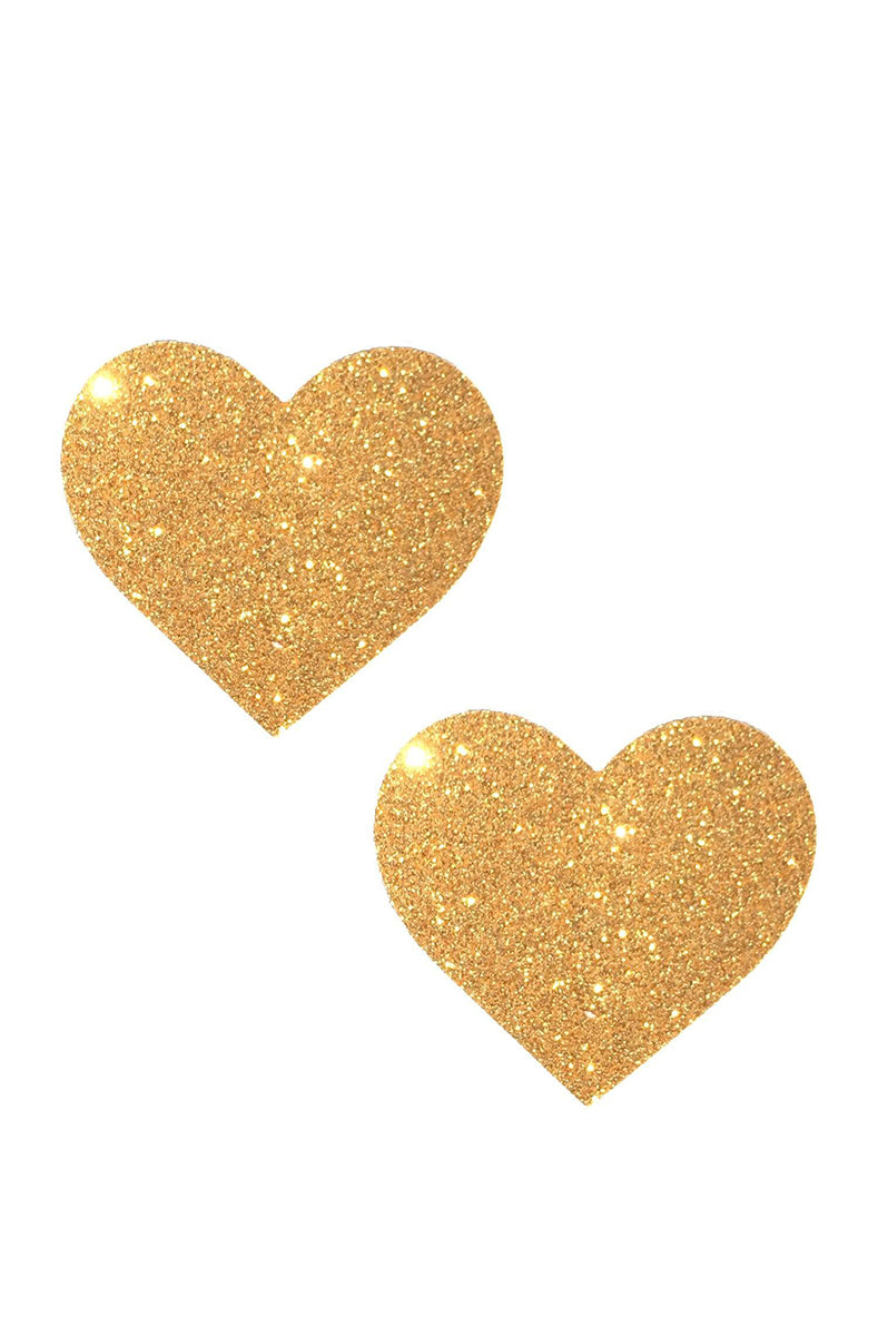 Two heart-shaped pasties cut from fine gold glitter with a soft fairy-dust shimmer.
