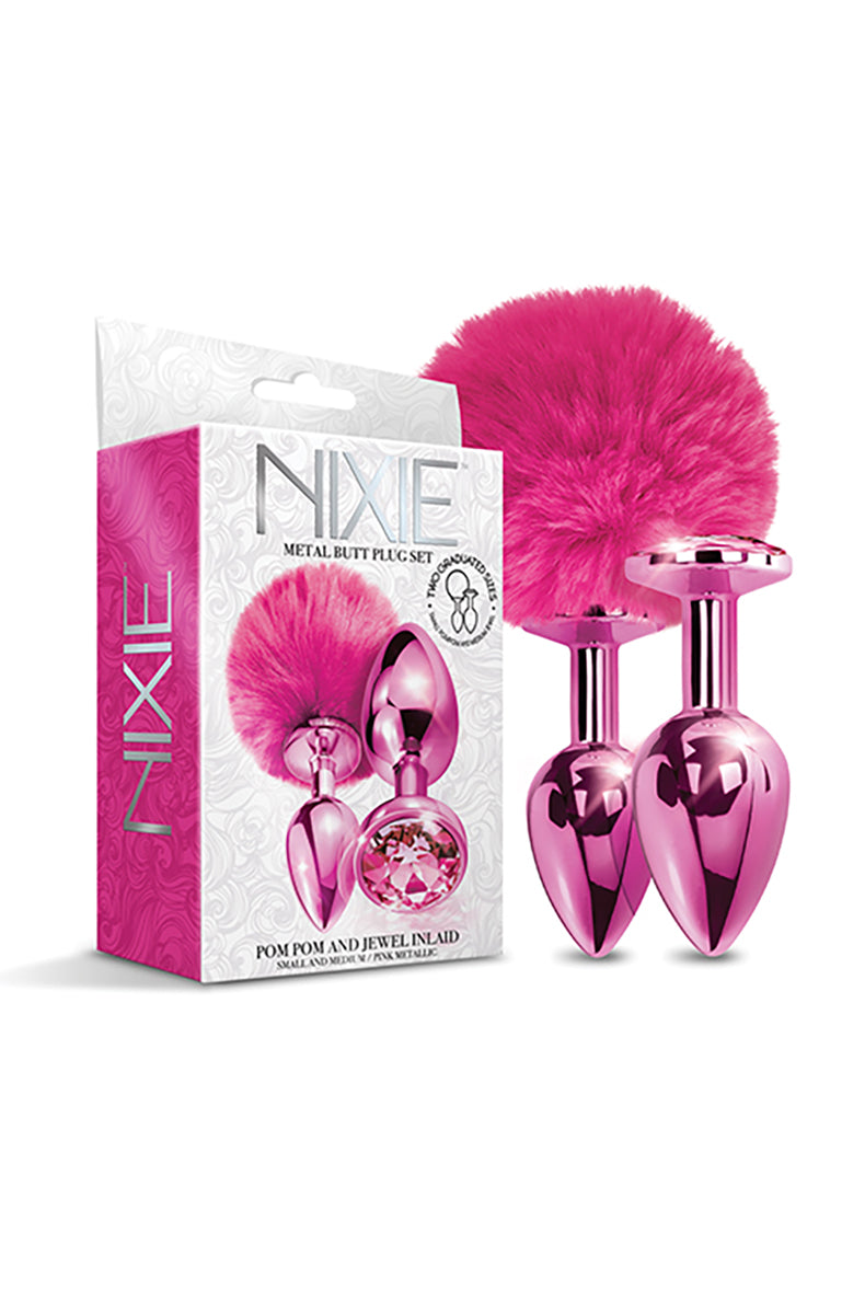 NIXIE pink metallic butt plug set with original box, showing the pom-pom plug and jewel plug in two graduated sizes.