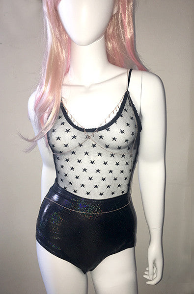 Black sheer mesh tank-style bodysuit with allover small black star print, thin spaghetti straps, scalloped lace edge at the neckline, and an opaque black thong-cut bottom.