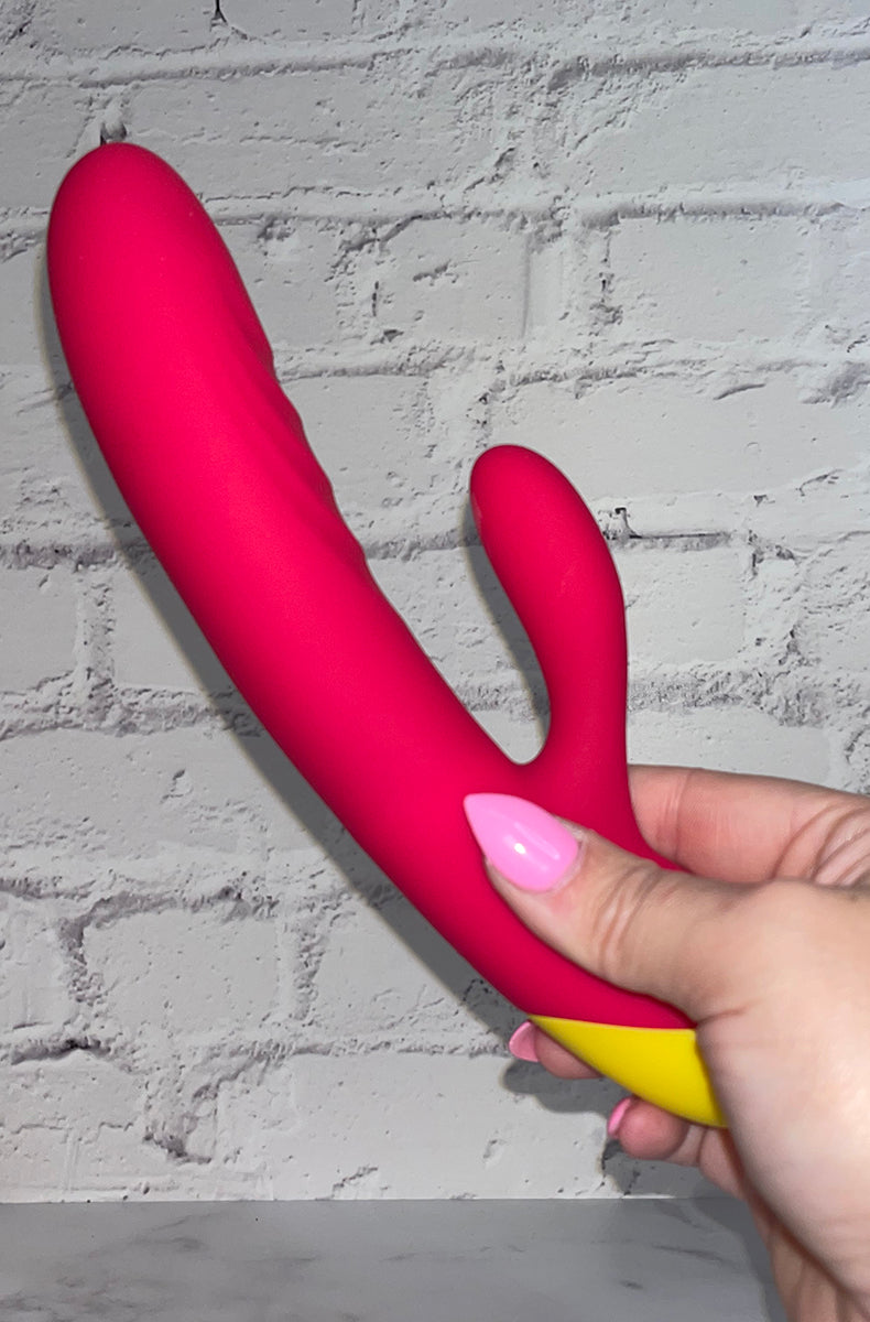 Side view of the Romp Jazz rabbit vibrator showing the ridges along the shaft and the curved tip.