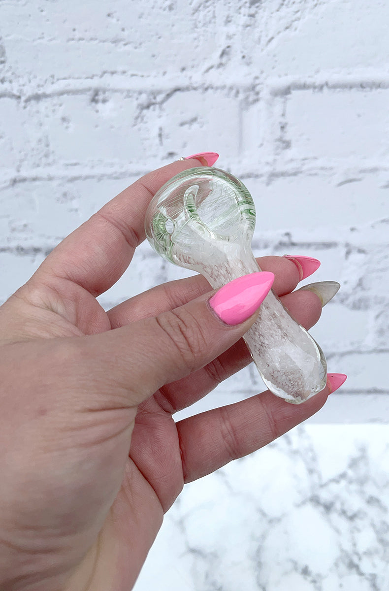 Glass swirl-and-fritted spoon pipe next to Blazy Susan King Size deluxe rolling kit.