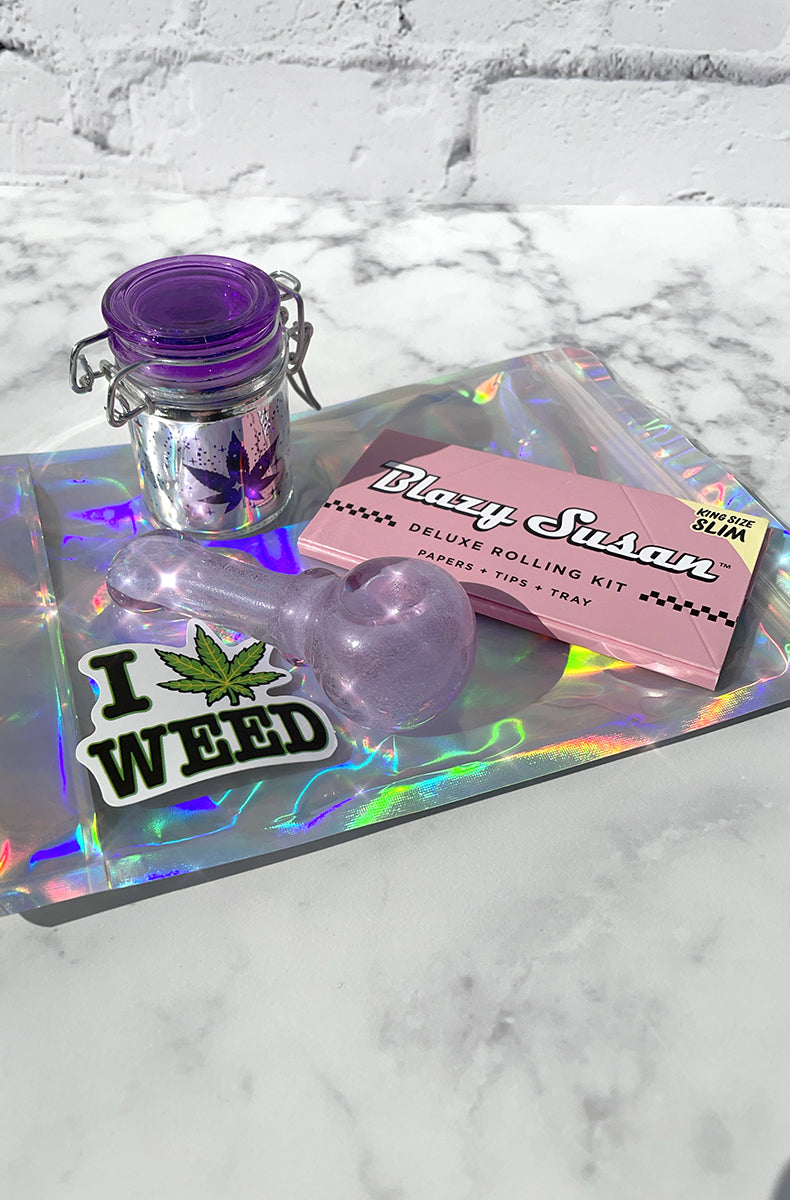 Stoner storage kit: glow-in-the-dark glass spoon pipe, hinged glass storage jar, Blazy Susan rolling kit, smell-proof bag.