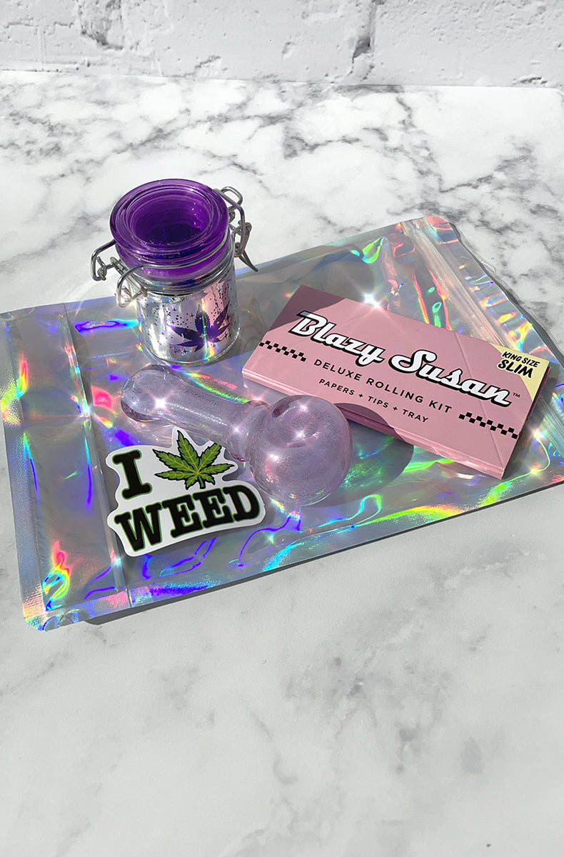 Stoner storage kit: glow-in-the-dark glass spoon pipe, hinged glass storage jar, Blazy Susan rolling kit, smell-proof bag.