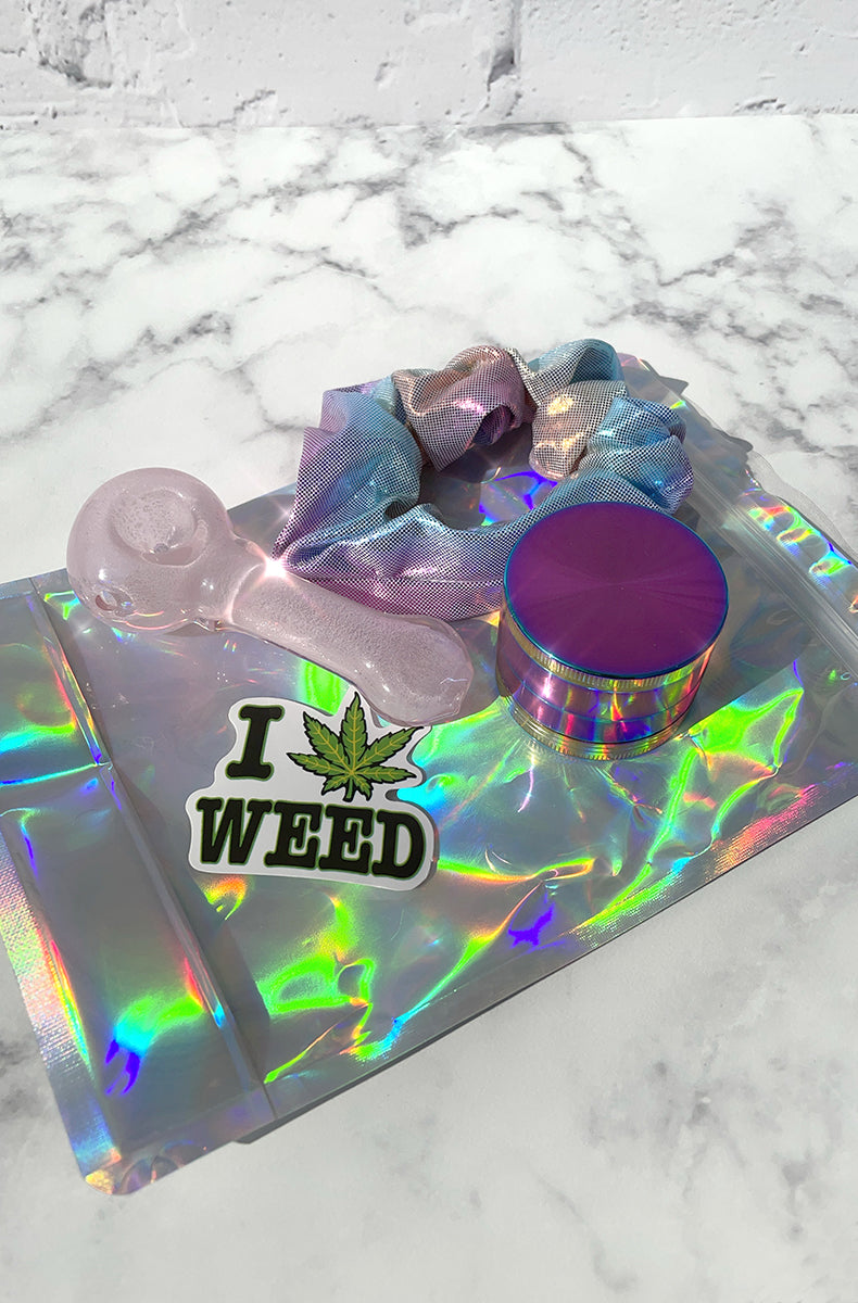 Stoner stash kit: glow-in-the-dark glass spoon pipe, rainbow zip-pocket scrunchie, 4-part rainbow grinder, smell-proof bag.