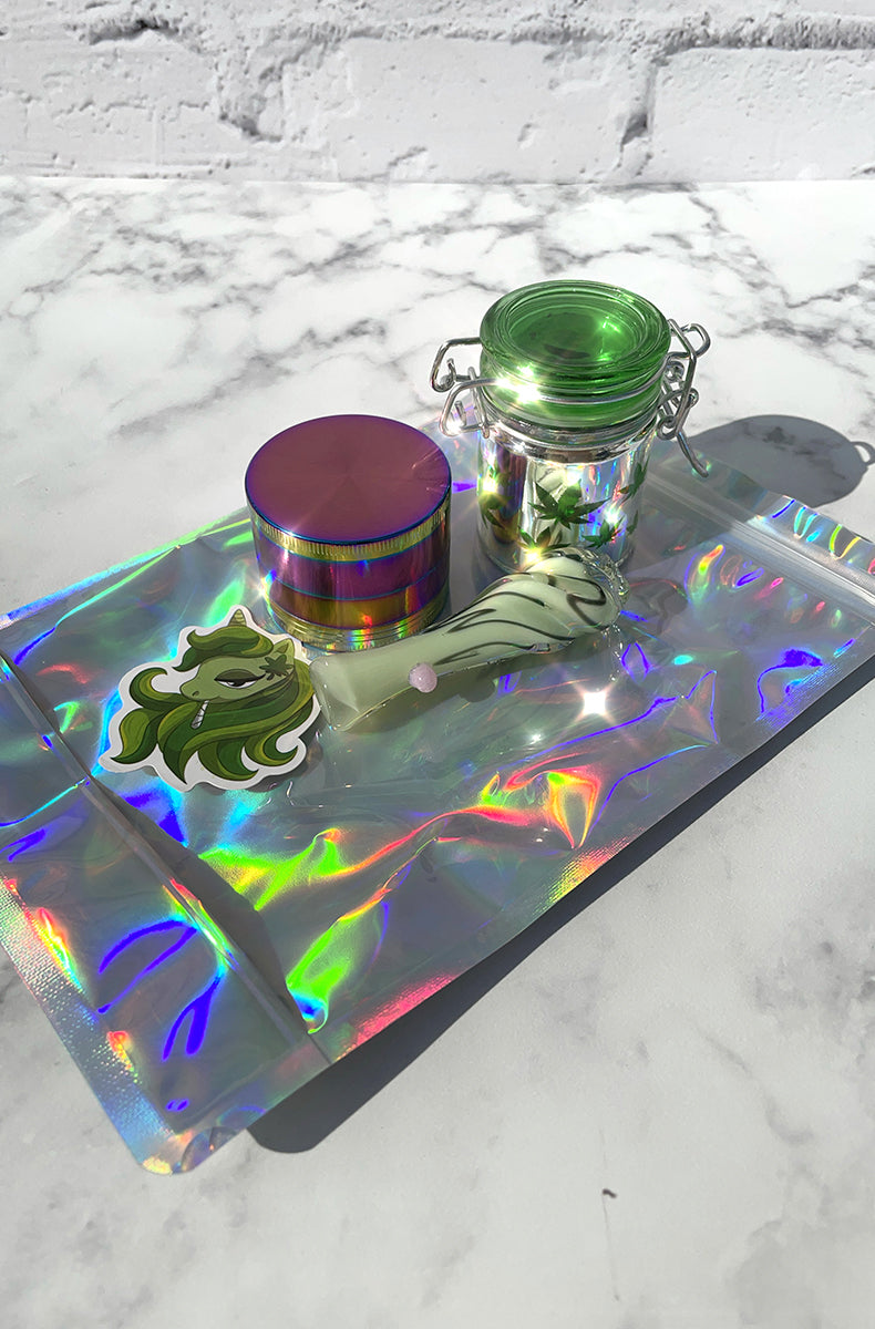 Holographic smell-proof ziplock pouch shown flat as the backdrop for the stash starter pack.