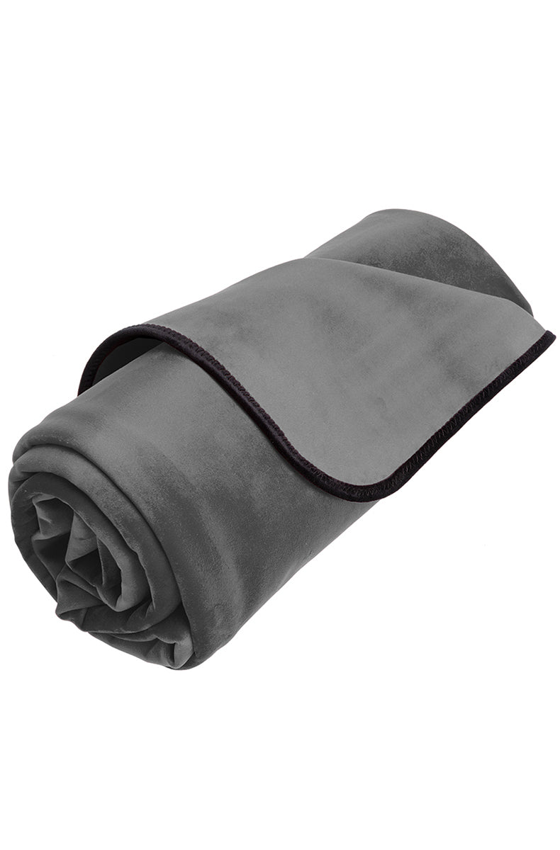 Liberator Travel Throw rolled up showing the soft gray brushed fabric and dark trim.