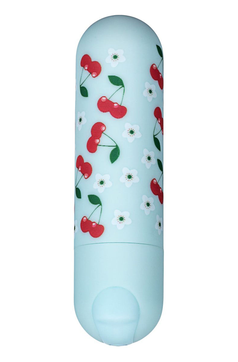 Pastel mint blue silicone bullet vibrator with red cherry and white flower print, rounded tip, push button on the base.
