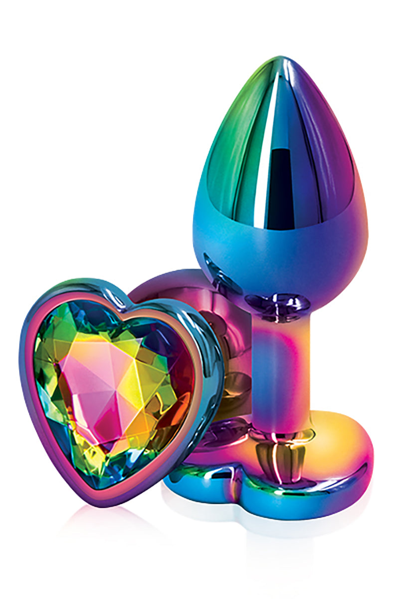 Rainbow chrome small butt plug with a tapered shaft and a flared heart base set with a rainbow heart gem. NS Novelties.