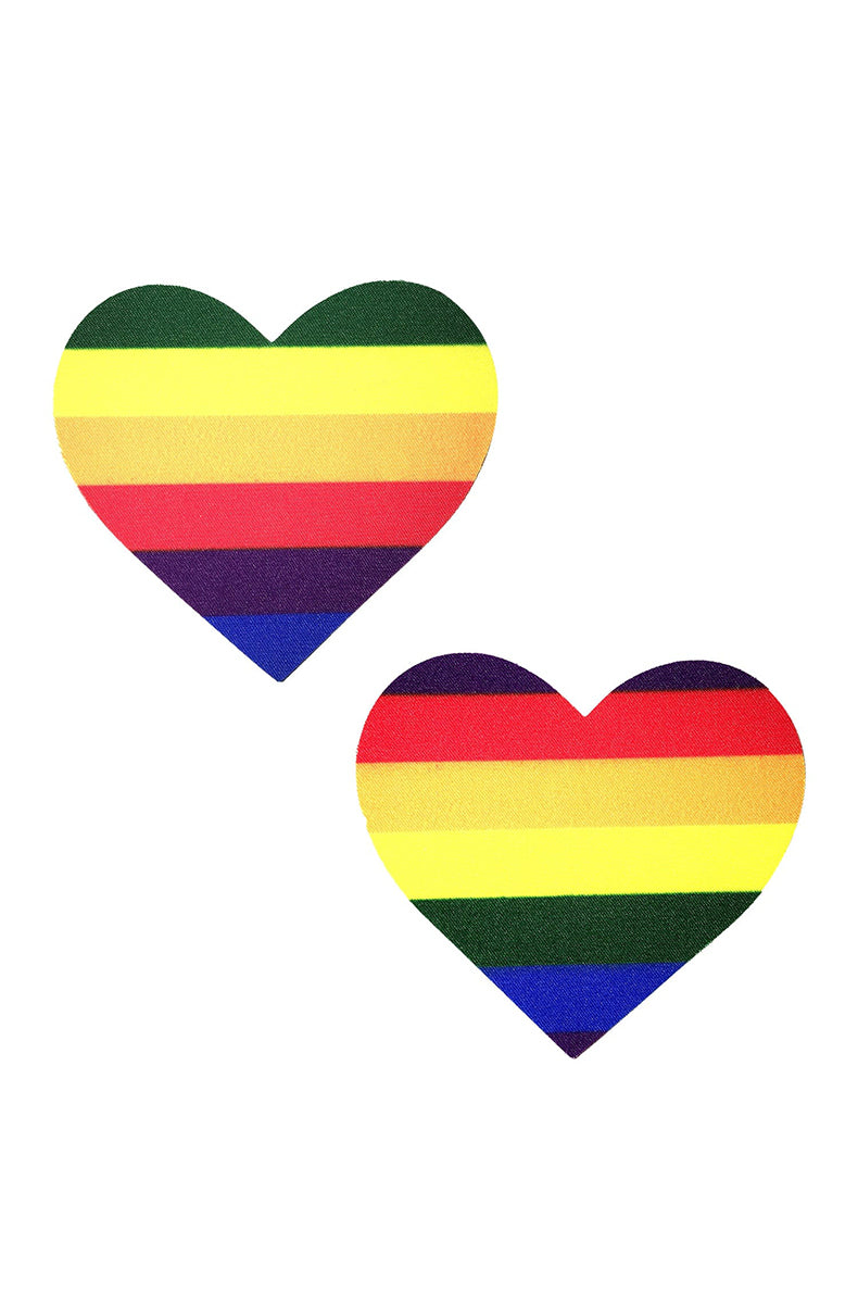 Two heart-shaped pasties printed with bold horizontal Pride-flag stripes in red, orange, yellow, green, blue, and purple.
