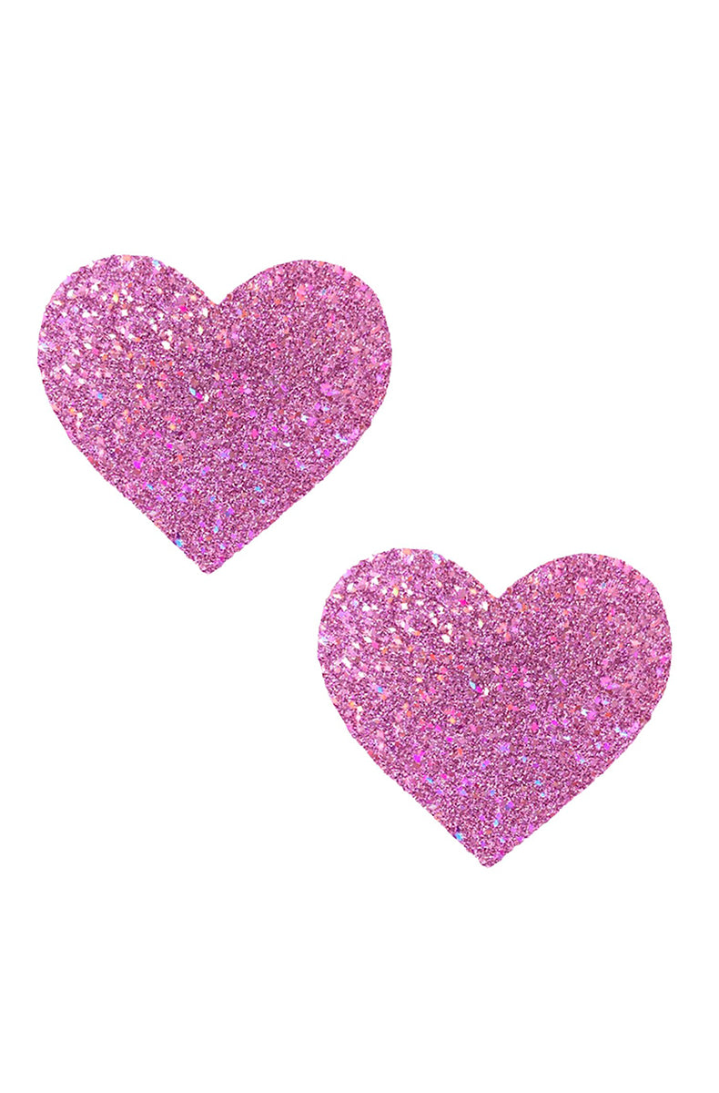 Two heart-shaped pasties in soft pink-purple iridescent glitter with holographic flakes scattered through the surface.