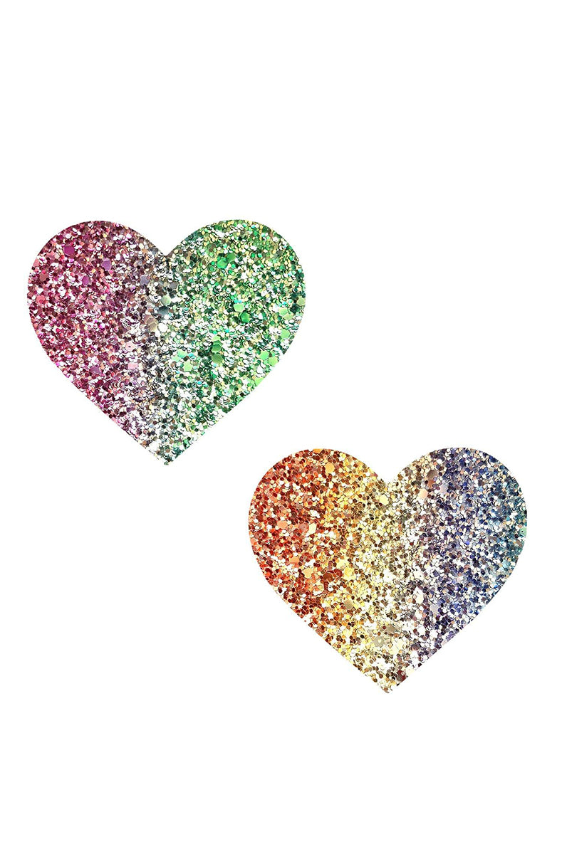 Two heart-shaped pasties in chunky rainbow rock-candy glitter, each sweeping through different multi-color regions.