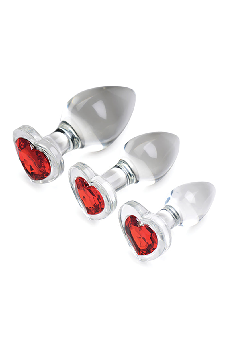Red heart glass butt plug set angled view showing all three plugs and red heart gems.