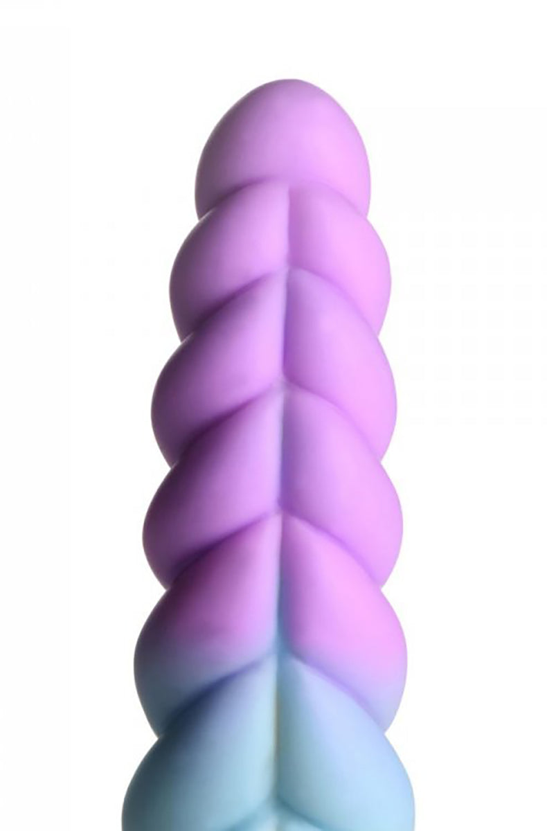 Close view of the twisted spiral shaft on the pastel silicone unicorn dildo, showing color fade purple to blue.