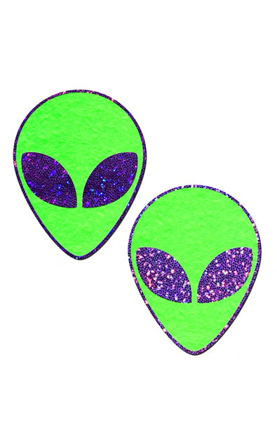 Two alien-head pasties in neon green glow-in-the-dark material with purple-glitter almond eyes.
