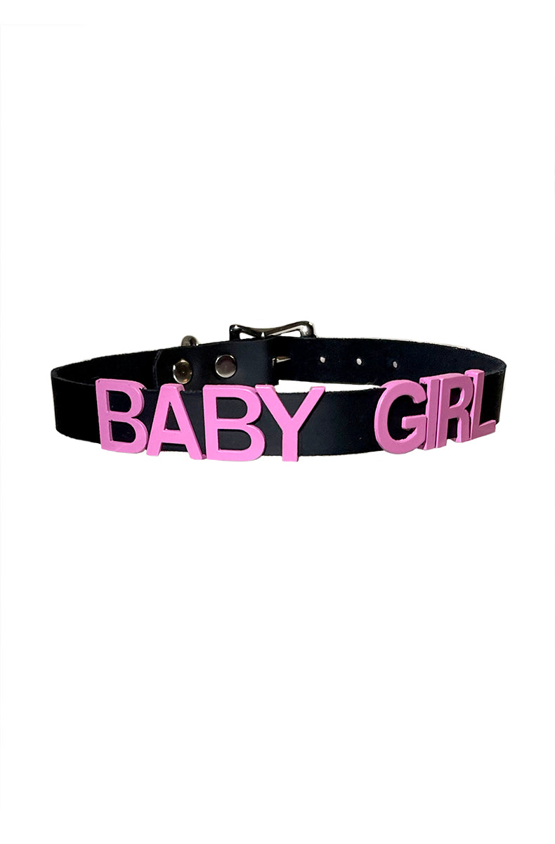 Black vegan-leather collar with "BABY GIRL" in bold pink lettering and a black buckle in the back.