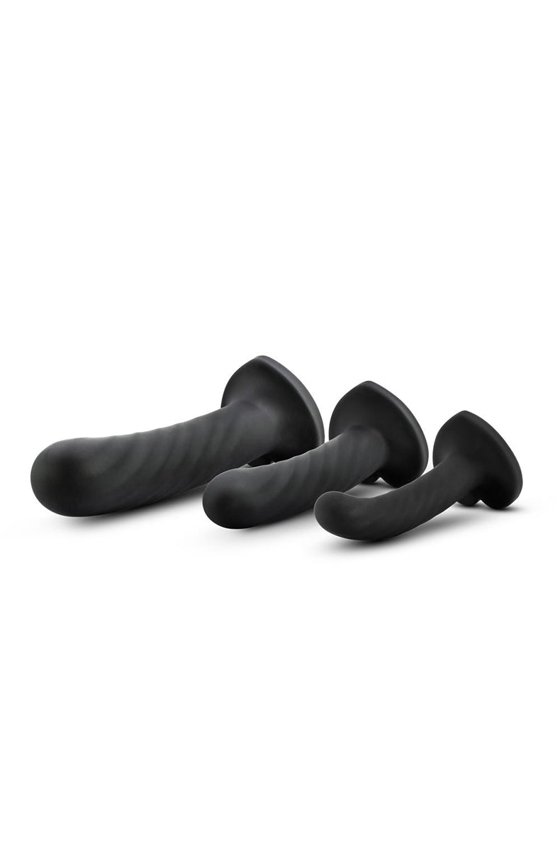 Side view of small Temptasia Twist black silicone dildo showing swirling texture and heart suction-cup base.