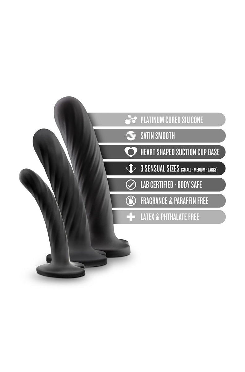 Side view of medium Temptasia Twist black silicone dildo showing swirling texture and heart suction-cup base.