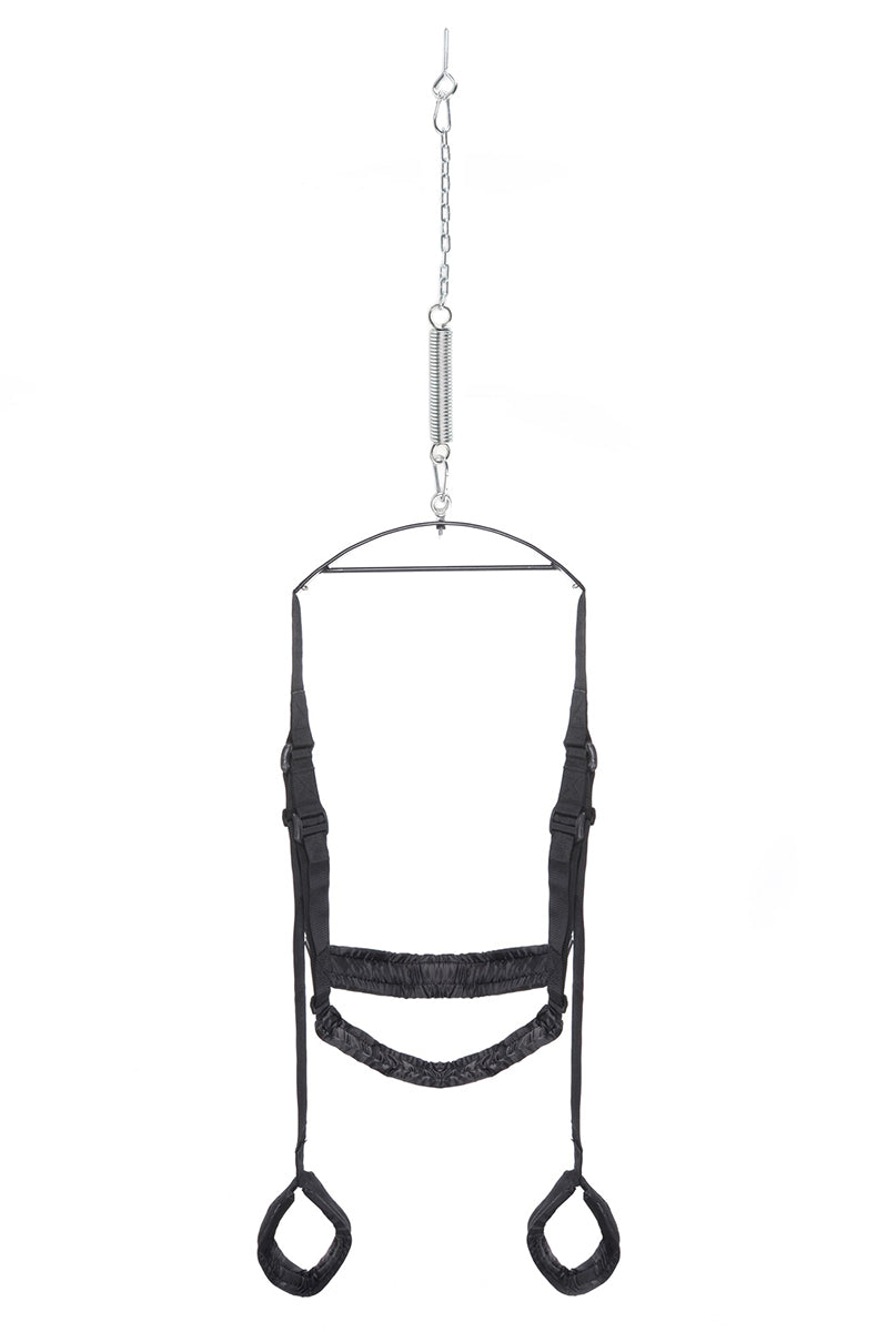 Black nylon Pipedream Fantasy Sex Swing with padded seat, leg stirrups, metal bar, torsion spring, and steel eyelet bolt.