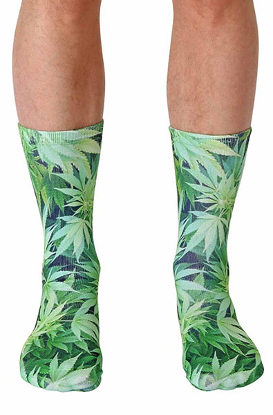 Crew socks with an all-over green cannabis leaf photo print covering cuff to toe.
