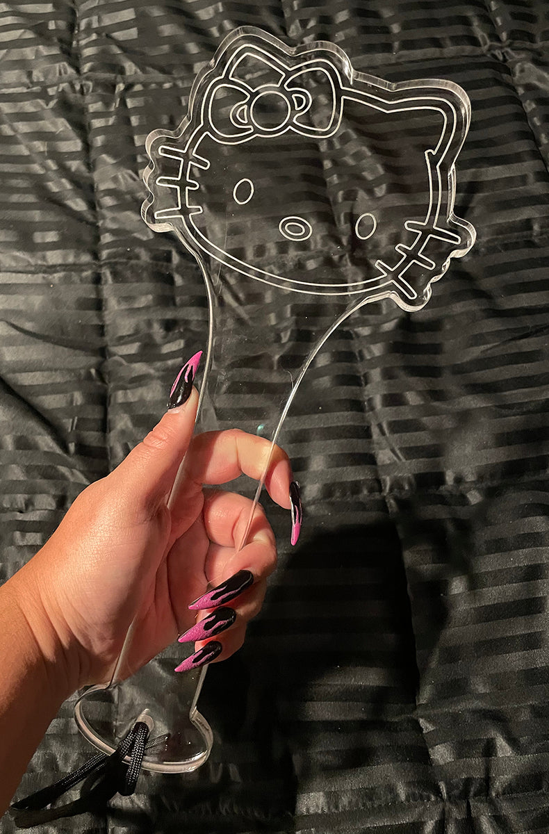 Clear cast acrylic paddle in a kawaii cat-head silhouette with etched bow, ears, eyes, whiskers, and mouth.