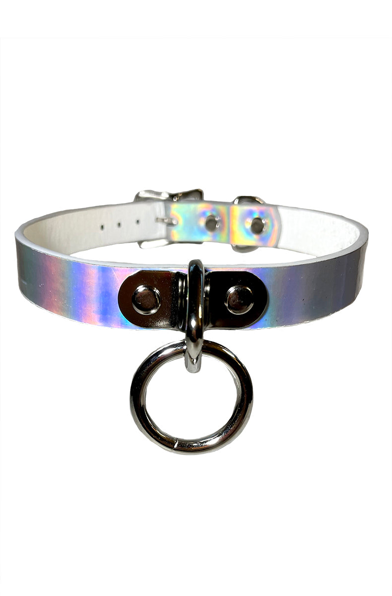 Holographic silver vegan-leather collar with a smooth iridescent finish and a single silver metal O-ring at the front center.