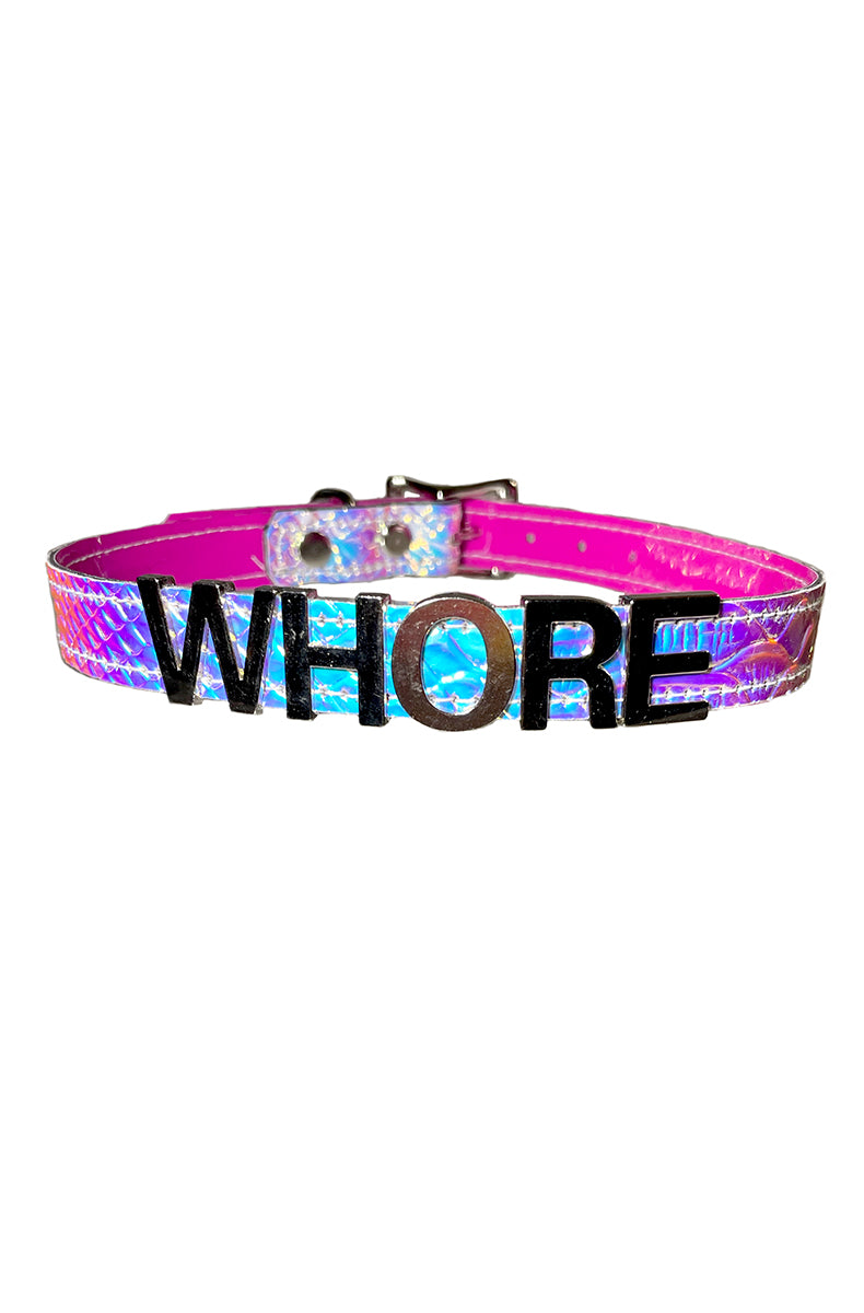 Pink-base holographic snakeskin-textured collar with "WHORE" in metallic silver chrome raised lettering across the front.