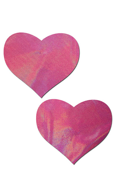 Two heart-shaped pasties in smooth bubblegum pink holographic film that shifts mint, lavender, and peach.