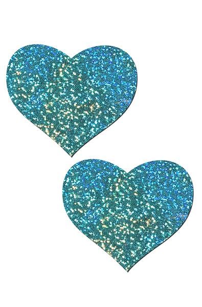 Two heart-shaped pasties in seafoam green-blue glitter with twinkling holographic flecks across the surface.